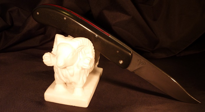 Folding knife piémontais, damasteel blade, ebony and reconstitute red stone handle